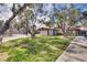 Exterior view of a well-maintained home with a green lawn and mature trees at 2532 Whippoorwill Ln, Las Vegas, NV 89121