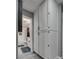Hallway view into a bathroom featuring updated cabinets for plenty of storage at 2532 Whippoorwill Ln, Las Vegas, NV 89121