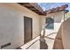 Rear patio with door and window showcases a private outdoor area perfect for relaxing or entertaining at 2532 Whippoorwill Ln, Las Vegas, NV 89121