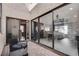 Outdoor patio featuring an outdoor seating area with access to the main living area through large sliding glass doors at 2532 Whippoorwill Ln, Las Vegas, NV 89121
