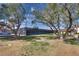 Enjoy a game of tennis on the community's well-maintained court, framed by mature trees and blue skies at 2532 Whippoorwill Ln, Las Vegas, NV 89121