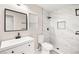 Modern bathroom featuring updated vanity, toilet, and shower with a sleek, tiled design at 2793 Sandyfalls Way, Las Vegas, NV 89142