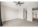 This bedroom features neutral walls and carpet, plus a ceiling fan for added comfort at 2793 Sandyfalls Way, Las Vegas, NV 89142