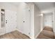 Hallway with wood floors leading to a front door at 2793 Sandyfalls Way, Las Vegas, NV 89142