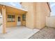 Exterior view of home's enclosed patio and stucco exterior with covered patio at 2793 Sandyfalls Way, Las Vegas, NV 89142