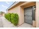 Inviting front entrance with security gate and well-maintained landscaping at 2793 Sandyfalls Way, Las Vegas, NV 89142