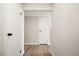 Hallway with wood floors leading to stairs and rooms at 2793 Sandyfalls Way, Las Vegas, NV 89142