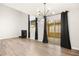 Open living area with hardwood floors, fireplace, and access to outdoor patio at 2793 Sandyfalls Way, Las Vegas, NV 89142