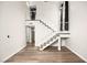 Bright open floor plan featuring hardwood floors, and staircase to the second floor at 2793 Sandyfalls Way, Las Vegas, NV 89142