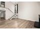 Bright living room featuring hardwood floors, and a staircase at 2793 Sandyfalls Way, Las Vegas, NV 89142