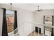 View from staircase featuring large windows, a black fireplace, and modern light fixture at 2793 Sandyfalls Way, Las Vegas, NV 89142