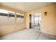 Enclosed sunroom featuring sliding door access to the home's interior at 2793 Sandyfalls Way, Las Vegas, NV 89142