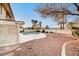 Backyard boasts a pool, gravel landscaping, mature trees and exterior building features at 2916 W Oakey Blvd, Las Vegas, NV 89102