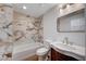 Bathroom featuring modern tile shower and a wood vanity with a sink and framed mirror at 2916 W Oakey Blvd, Las Vegas, NV 89102