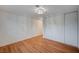 A clean bedroom features closet, white walls, wood floor and modern ceiling light at 2916 W Oakey Blvd, Las Vegas, NV 89102