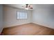 Bright bedroom featuring a ceiling fan and a window with plantation shutters at 2916 W Oakey Blvd, Las Vegas, NV 89102