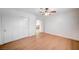 Bedroom boasts light wood floors, white walls, ceiling fan, closet, and hallway entrance at 2916 W Oakey Blvd, Las Vegas, NV 89102