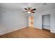 Bedroom with wood-look floors, ceiling fan, and a closet with open shelves at 2916 W Oakey Blvd, Las Vegas, NV 89102