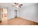 Bedroom featuring hardwood floors, a ceiling fan, and a closet with shelving at 2916 W Oakey Blvd, Las Vegas, NV 89102