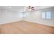 A bright bedroom featuring wooden flooring and natural light from windows at 2916 W Oakey Blvd, Las Vegas, NV 89102