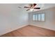 Neutral bedroom with ceiling fan, light wood floors, and natural light at 2916 W Oakey Blvd, Las Vegas, NV 89102