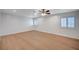 Bedroom featuring hardwood floors, a ceiling fan, and windows with white shutters at 2916 W Oakey Blvd, Las Vegas, NV 89102