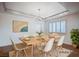 Staged dining room featuring a modern light fixture and a large window with wood shutters at 2916 W Oakey Blvd, Las Vegas, NV 89102