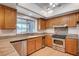 Kitchen features granite countertops, stainless steel appliances, and wood cabinets at 2916 W Oakey Blvd, Las Vegas, NV 89102