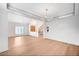 Spacious living area featuring wood floors and modern lighting fixtures at 2916 W Oakey Blvd, Las Vegas, NV 89102