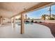 Covered patio with view of a lush pool and landscaping in a private backyard setting at 2916 W Oakey Blvd, Las Vegas, NV 89102