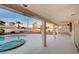 Covered patio boasts views of a pool, gravel landscaping, and privacy wall at 2916 W Oakey Blvd, Las Vegas, NV 89102