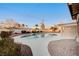 Enjoy this backyard featuring a swimming pool, spa, and brick-paved patio, perfect for outdoor entertaining at 2916 W Oakey Blvd, Las Vegas, NV 89102