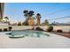 Backyard featuring a swimming pool, spa, and gravel landscaping, surrounded by a privacy wall at 2916 W Oakey Blvd, Las Vegas, NV 89102