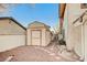 Outdoor shed with neutral paint and gravel surroundings, sitting next to the home at 2916 W Oakey Blvd, Las Vegas, NV 89102