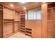 Beautiful wood paneled walk-in closet with ample storage and shelving units at 2916 W Oakey Blvd, Las Vegas, NV 89102