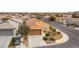 Aerial view of the home showcasing the driveway, landscaping, and neighborhood at 2970 Strathspey Ct, Henderson, NV 89044