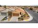 Aerial view of house highlighting the landscaped front yard and neighborhood streets at 2970 Strathspey Ct, Henderson, NV 89044