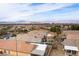 Aerial view highlighting the community, a pool, and mountain views at 2970 Strathspey Ct, Henderson, NV 89044