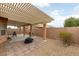 Backyard featuring a covered patio, seating area, and landscaped with rocks at 2970 Strathspey Ct, Henderson, NV 89044