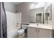 Clean bathroom featuring a shower-tub combo and vanity with cabinets at 2970 Strathspey Ct, Henderson, NV 89044
