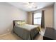 Comfortable bedroom with a ceiling fan and natural light from the window at 2970 Strathspey Ct, Henderson, NV 89044