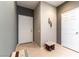 Bright entryway featuring neutral tiling, gray walls, and a charming accent stool at 2970 Strathspey Ct, Henderson, NV 89044