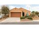 Charming single-story home with a well-manicured front yard and a two-car garage at 2970 Strathspey Ct, Henderson, NV 89044