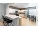 Bright kitchen with white cabinets, breakfast bar, and stainless steel appliances at 2970 Strathspey Ct, Henderson, NV 89044