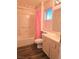 Pink themed bathroom with tub and wood floor at 3117 Brightridge Dr, Las Vegas, NV 89134