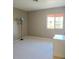 Neutral bedroom featuring plush carpet and a bright window at 3117 Brightridge Dr, Las Vegas, NV 89134