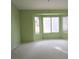Large bedroom with carpet and large windows at 3117 Brightridge Dr, Las Vegas, NV 89134