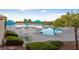 Inviting community pool area with lounge chairs, umbrellas, and well-maintained landscaping at 3117 Brightridge Dr, Las Vegas, NV 89134