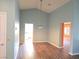 Bright dining space featuring vaulted ceiling, with view to kitchen and hallway at 3117 Brightridge Dr, Las Vegas, NV 89134
