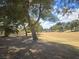 Expansive community green space featuring mature trees, a bridge, and well-kept grounds at 3117 Brightridge Dr, Las Vegas, NV 89134